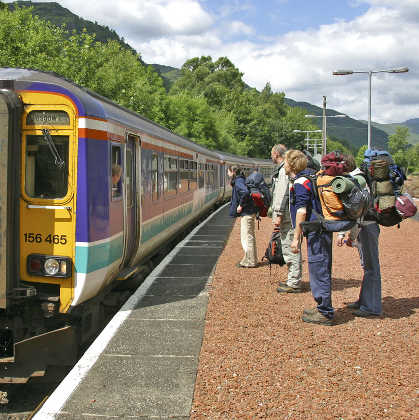 passengers-waiting-on-platform-with-train
