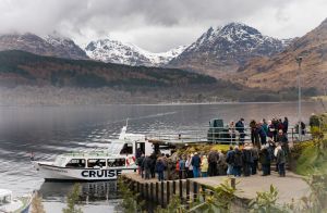 Boat on loch with mountains behind