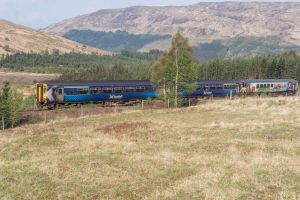 Train with hills behind